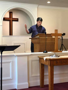 Brandon preaching sermon at Pathfinders